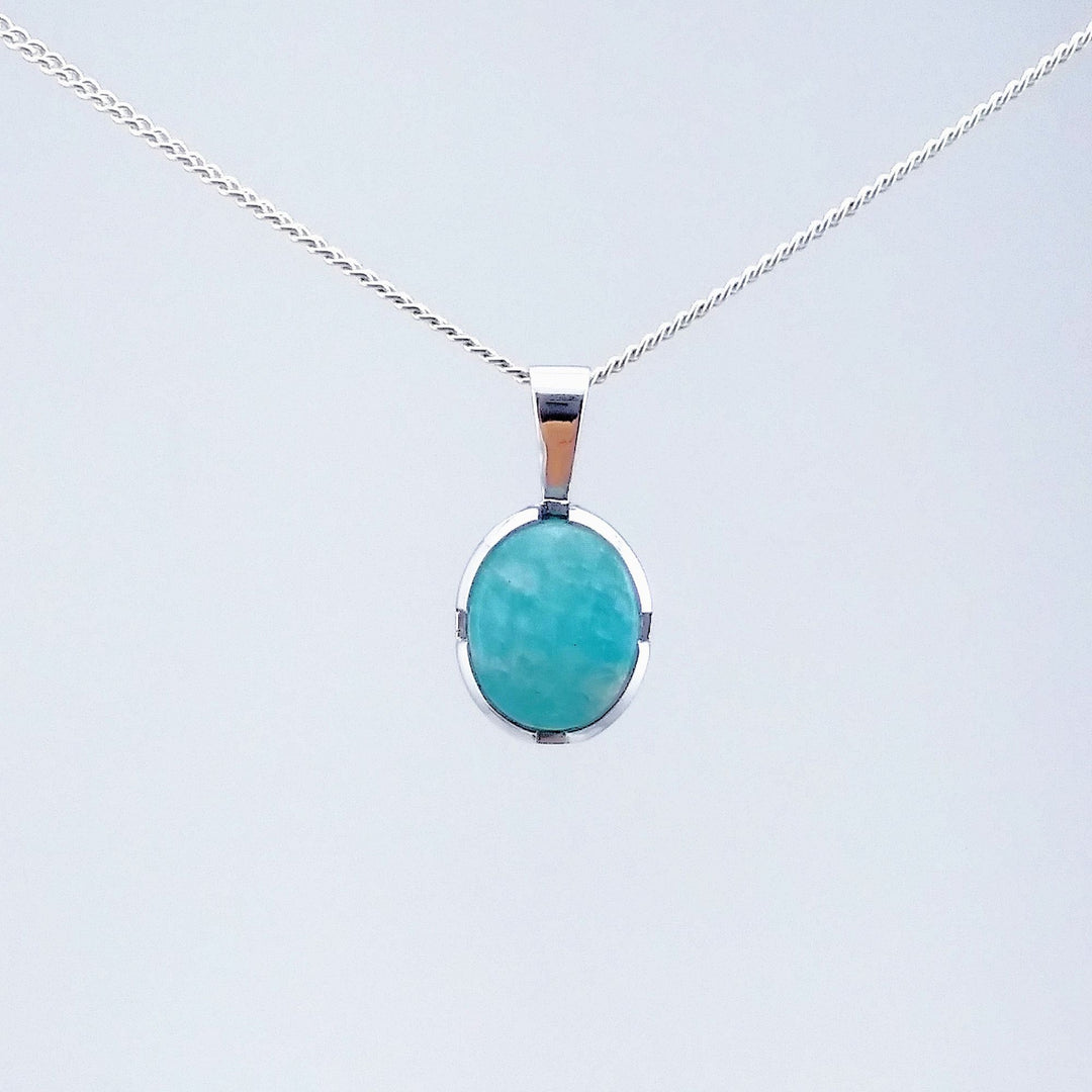 Collier argenté avec pendantif turquoise