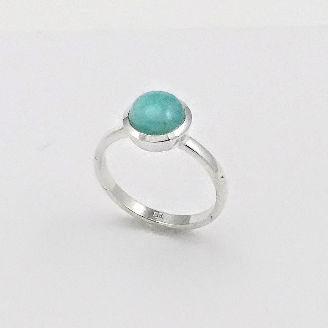 Bague argentée avec pierre de couleur turquoise