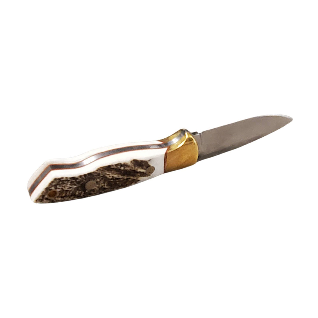 Couteau de chasse Matapedia par Lamoureux and sons édition laiton sur le dos