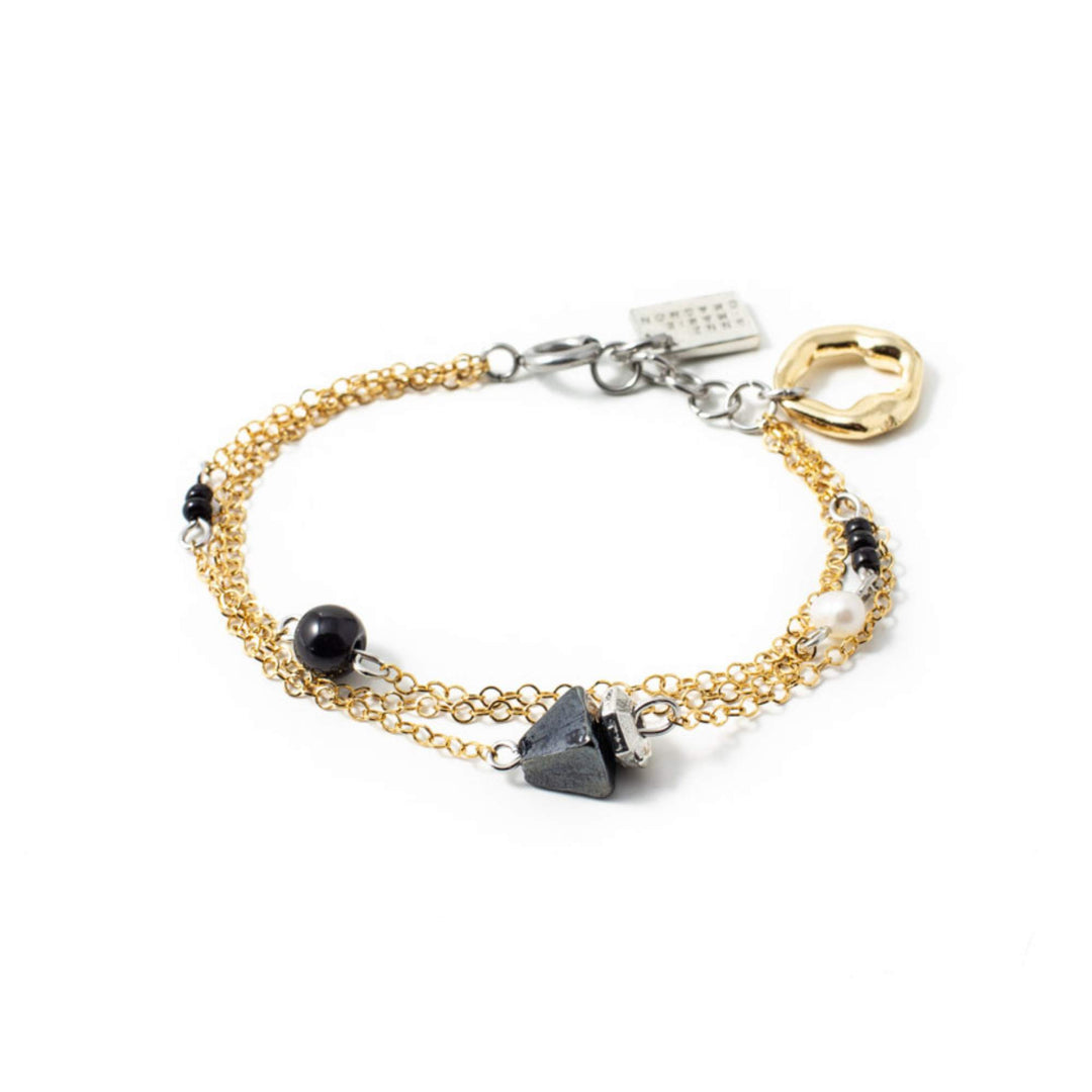 Bracelet anne-marie chagnon avec chaîne dorée et billes noires