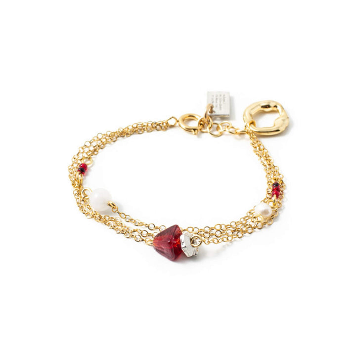 Bracelet anne-marie chagnon avec chaîne dorée et billes rouges