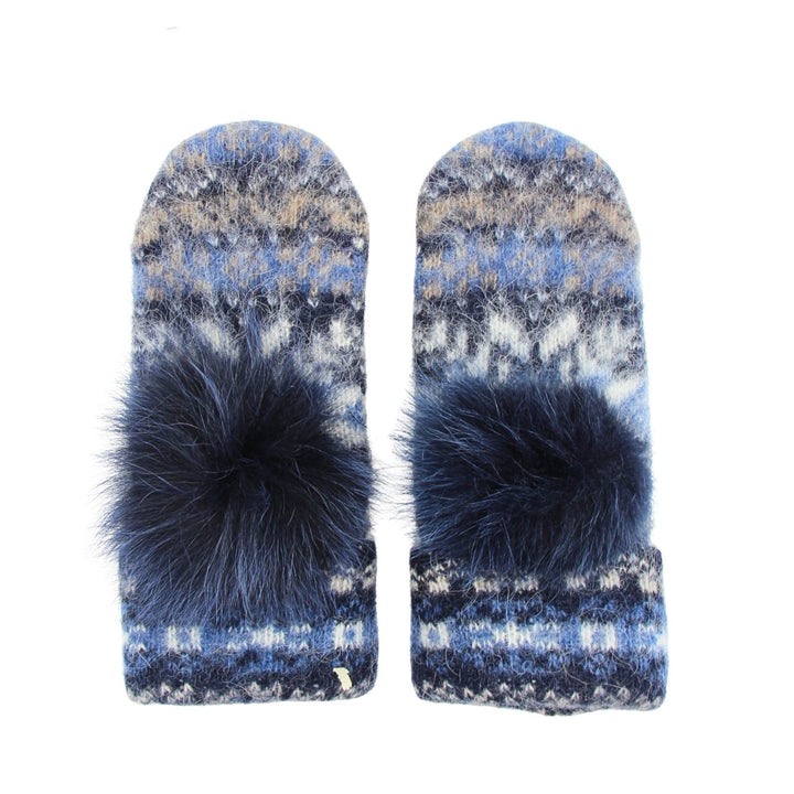 Mitaines en laine islandaise blanches, bleue pâle et marines avec un pompom bleu marine sur le dessus vu de haut