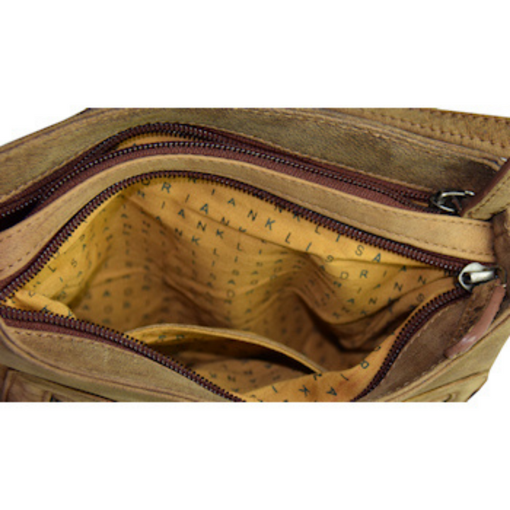 Intérieur d'un compartiment d'un sac à main en cuir de bison avec fermetures à glissière