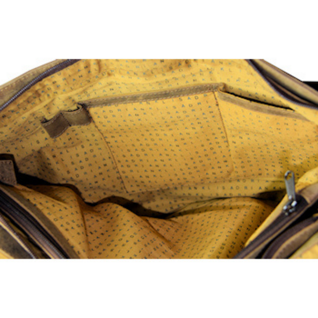 Intérieur d'un sac en cuir de bison avec deux pochettes et un rangement à crayons
